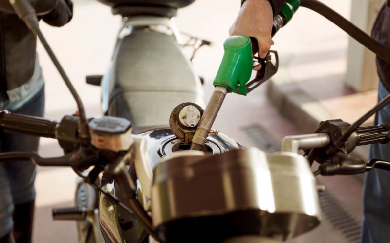 Filling a motorcycle with fuel